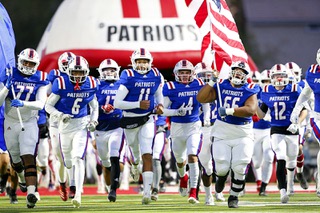 The Liberty Patriots head onto the field for a football game against the Arbor View Aggies at Liberty High School in Henderson Friday, Oct. 4, 2022.