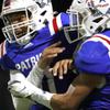Liberty quarterback Tyrese Smith, left, celebrates with wide receiver Jayden Robertson (7) after Robertsons touchdown during the second half of a football game at Liberty High School in Henderson Friday, Nov. 4, 2022.