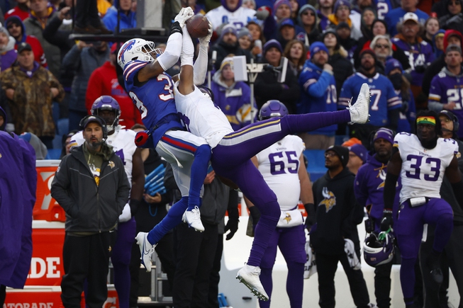 Minnesota Vikings wide receiver Justin Jefferson (18) makes an incredible catch in front of Buffalo Bills safety Cam Lewis (39) during the second half of an NFL football game in Orchard Park, N.Y., Sunday Nov. 13, 2022.