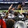 Silverado Skyhawks quarterback Brandon Tunnell (11) is lifted up by his team as they win the 4A state title trophy after defeating the Shadow Ridge Mustangs, 51-27, during a game at Allegiant Stadium Monday, Nov. 21, 2022.
