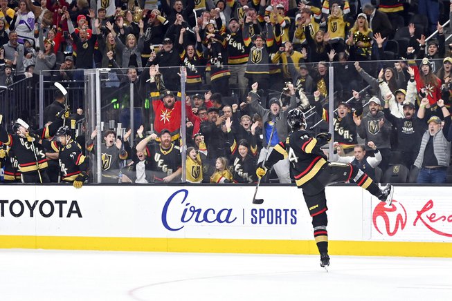 Vegas Golden Knights defenseman Nicolas Hague (14) reacts after scoring the winning goal during overtime of an NHL hockey game against the Nashville Predators, Saturday, Dec. 31, 2022, in Las Vegas. 

