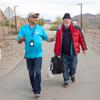Louis Lacey, left, director of homeless response teams for HELP of Southern Nevada, walks with Christopher Jaynes, a homeless man, in Henderson Thursday, Jan. 12, 2023. HELP of Southern Nevada arranged for a motel room for Jaynes.