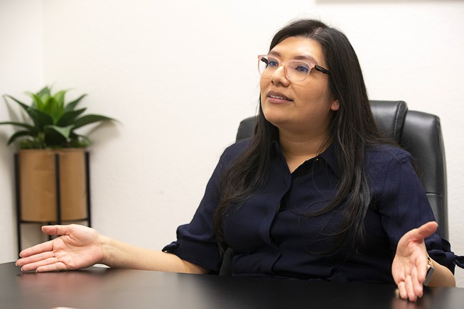 Janette Amador, community outreach coordinator at the Immigrant Home Foundation, responds to a question during an interview at the foundation office Tuesday, Jan. 24, 2023. 