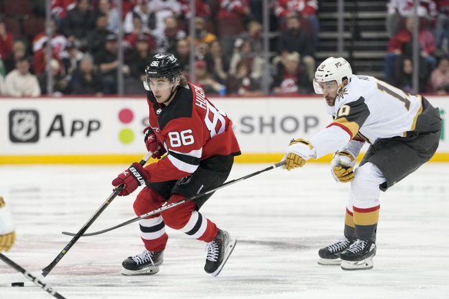 New Jersey Devils center Jack Hughes (86) skates past Vegas Golden Knights center Nicolas Roy (10) during the second period Tuesday, Jan. 24, 2023, in Newark, N.J. 


