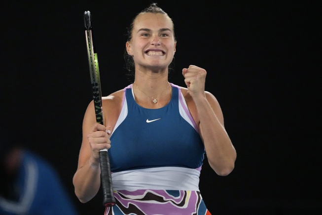 Aryna Sabalenka of Belarus celebrates after defeating Magda Linette of Poland during their semifinal match at the Australian Open tennis championship in Melbourne, Australia, Thursday, Jan. 26, 2023.


