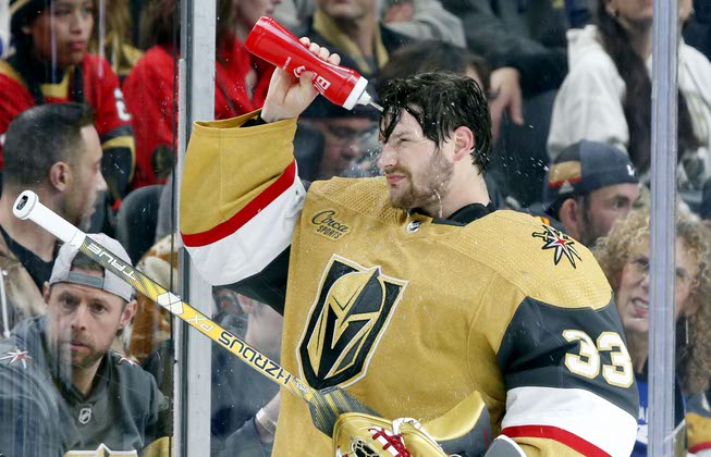 Vegas Golden Knights goaltender Adin Hill (33) takes a water break during an NHL hockey game against the Tampa Bay Lightning at T-Mobile Arena Saturday, Feb. 18, 2023.