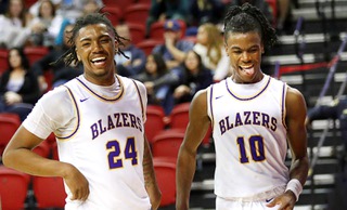 Durango High School players Taj Degourville (24) and Tylen Riley (10) celebrate their 57-47 victory over Liberty in the NIAA boys 5A state championship at the Thomas & Mack Center Saturday, Feb. 25, 2023.
