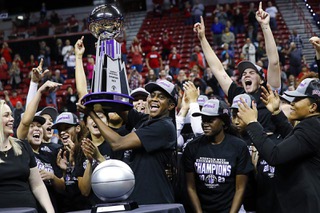 UNLV Lady Rebels center Desi-Rae Young, center, celebrates with the team after the Lady Rebels beat the Wyoming Cowgirls, 71-60, to win the Mountain West tournament championship at the Thomas & Mack Center Wednesday, March 8, 2023.