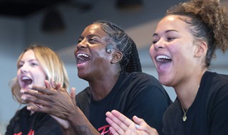 Lady Rebels react as their NCAA Tournament selection is broadcast during a watch party at the Thomas & Mack Center Sunday, March 12, 2023. From left, Kenadee Winfrey, Desi-Rae Young and Nneka Obiazor. The Lady Rebels will face Michigan in Baton Rouge, Louisiana on Friday.