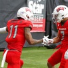 UNLV Rebels wide receiver Ricky White (11) is congratulated by wide receiver Jacob De Jesus (7) after making a touchdown catch during the UNLV Spring Showcase at Allegiant Stadium Saturday, April 8, 2023.