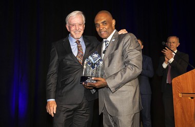 Billy Walters, left, famed sports better and philanthropist, receives the Champion of Hope Award from Jon Ponder, founder and CEO of Hope for Prisoners, during the Hope For Prisoners: A Night for Second Chances fundraising dinner at Resorts World Las Vegas Wednesday, April 19, 2023.