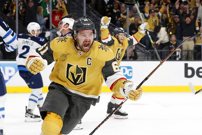 Vegas Golden Knights right wing Mark Stone (61) celebrates after his second goal in the third period of Game 2 of an NHL hockey Stanley Cup first-round playoff series against the Winnipeg Jets at T-Mobile Arena Thursday, April 20, 2023, in Las Vegas. The Golden Knights beat the Jets, 5-2. 