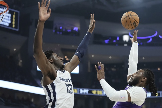 Milwaukee Bucks' Jae Crowder shoots over Memphis Grizzlies' Jaren Jackson Jr. during the first half of an NBA basketball game Friday, April 7, 2023, in Milwaukee.