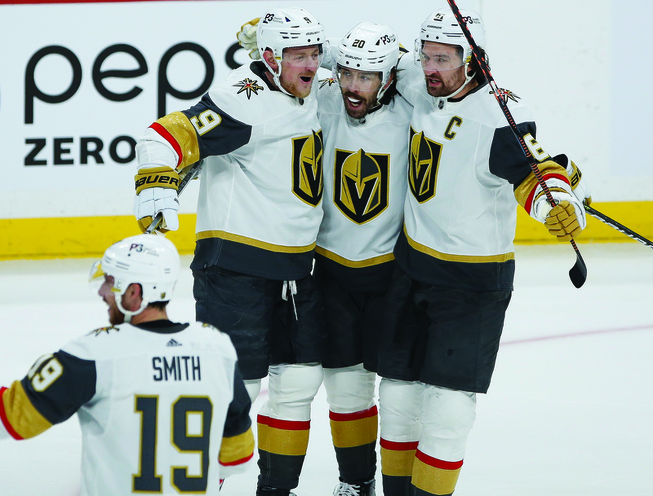 Vegas Golden Knights' Reilly Smith (19), Jack Eichel (9), Chandler Stephenson (20) and Mark Stone (61) celebrate Eichel's goal against the Winnipeg Jets during the first period of Game 3 of an NHL hockey Stanley Cup first-round playoff series, Saturday, April 22, 2023, Winnipeg, Manitoba. 