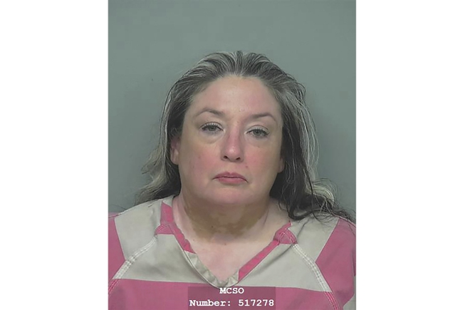 This Montgomery County Jail photo shows Divimara Lamar Nava. Montgomery County Sheriff Rand Henderson says 53-year-old Divimara Lamar Nava, wife of suspect Francisco Oropeza, was in custody in connection with the Friday night shooting in Cleveland, Texas.

