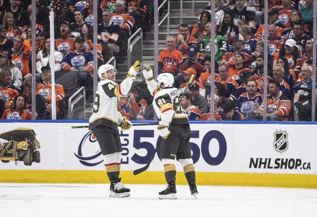 Vegas Golden Knights' Ivan Barbashev (49) and Jonathan Marchessault (81) celebrate Marchessault's goal against the Edmonton Oilers during the second period in Game 6 of an NHL Stanley Cup second-round playoff hockey series in Edmonton, Alberta, Sunday, May 14, 2023. 