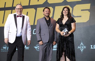 Unsung Hero award recipient Rachel Levy, a Desert Oasis High School trainer, poses with Ray Brewer, left, Las Vegas Sun managing editor, and Darrell Padilla, a senior finance manager at Barrick Gold Corporation, during the 2023 Sun Standout Awards at the South Point Showroom Monday, May 22, 2023. Barrick Gold Corporation sponsored the award.