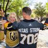 Lynne Portaro poses with her husband Ron Portaro as he shows off a custom Oct. 1 Vegas Golden Knights jersey in The Park before Game 1 of the Stanley Cup Final between the Golden Kinights and the Florida Panthers at T-Mobile Arena Saturday, June 3, 2023.
