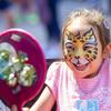 Aria J., 4, looks at a mirror after getting her face painted in Toshiba Plaza before Game 5 of the Stanley Cup Final at T-Mobile Arena Tuesday, June 13, 2023, in Las Vegas.