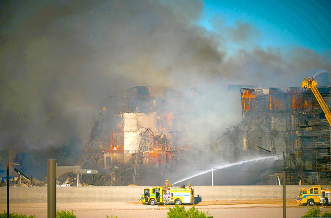A fire burns at a multi-story apartment complex under construction near the I-215 Beltway and Durango Drive Tuesday, June 20, 2023.