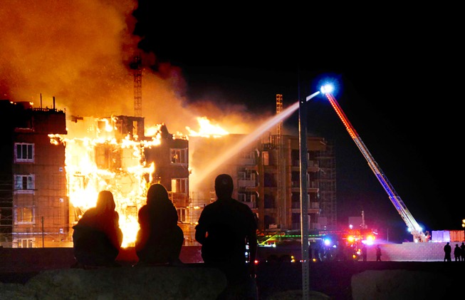 Clark County firefighters put water on a fire at a multi-story apartment complex under construction near the I-215 Beltway and Durango Drive Tuesday, June 20, 2023.