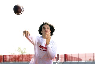 Arbor View High School incoming freshman quarterback Thaddeus Thatcher, 16, passes to his brother at the school Thursday, June 29, 2023.