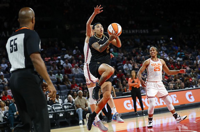 Las Vegas Aces guard Kierstan Bell (1) drives to the basket during the second half of a WNBA basketball game against the Connecticut Sun at Michelob Ultra Arena in Mandalay Bay Saturday, July 1, 2023.