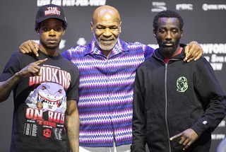 Former heavyweight champion Mike Tyson poses with WBC/WBA/IBF welterweight champion Errol Spence Jr., left, and WBO champion Terence Crawford during a news conference at T-Mobile Arena Thursday, July 27, 2023. The undefeated champions are scheduled for a unification title fight at the arena Saturday.