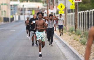 Canyon Springs High School football players head to Woodlawn Cemetery during an early morning run Saturday, July 29, 2023. The annual run, started by former Canyon Springs football coach Hunkie Cooper, is designed to encourage players to make proper decisions in life.