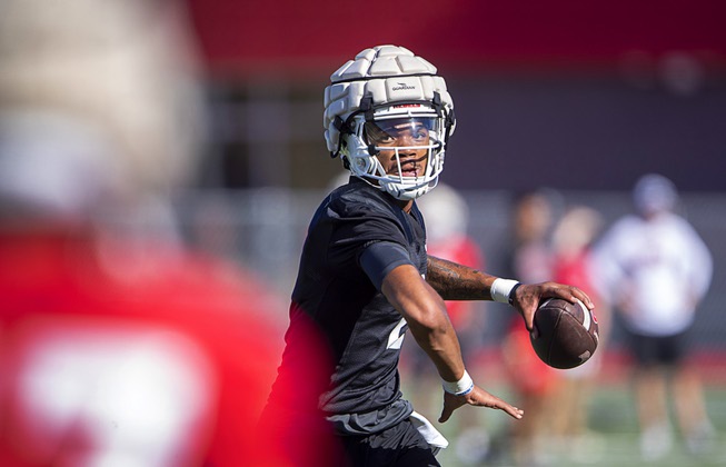 UNLV quarterback Doug Brumfield (2) passes while on the run during UNLV football training camp at Rebel Park Friday, Aug. 4, 2023.