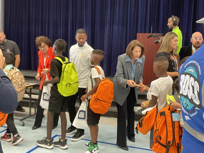 Nevada U.S. Sens. Jacky Rosen, wearing red blazer, and Catherine Cortez Masto, wearing gray blazer, hand out school supplies on the first day of classes at Matt Kelly Elementary School in Las Vegas on Monday, Aug. 7, 2023.
