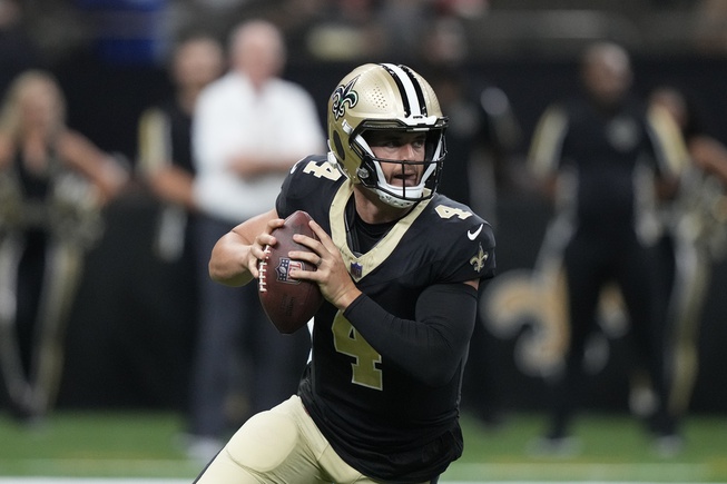 New Orleans Saints quarterback Derek Carr (4) looks to pass the ball in the first half of a preseason NFL football game against the Kansas City Chiefs in New Orleans, Sunday, Aug. 13, 2023. 
