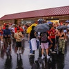 Students gather at Coronado High School after a football game is cancelled during a rain storm Friday, Aug. 18, 2023. The southwest is expected to experience significant rainfall this weekend due to Hurricane Hilary, according to weather forecasters.
