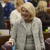 Nevada Republican Assemblywoman Heidi Kasama laughs with lawmakers in Carson City on Feb. 6, 2023.
