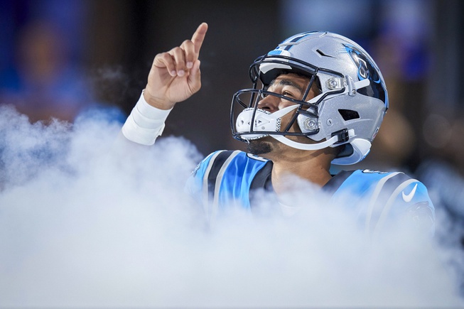 Carolina Panthers quarterback Bryce Young points to the sky as he takes the field prior to an NFL preseason football game against the Detroit Lions, Friday, Aug. 25, 2023, in Charlotte, N.C.