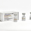 This photo provided by Pfizer in September 2023 shows single-dose vials of the company's updated COVID vaccine for adults.
