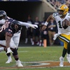 Green Bay Packers quarterback Jordan Love (10), right, runs with the ball during the second half of an NFL football game against the Chicago Bears in Chicago, Sunday, Sept. 10, 2023. The Packers won 38-20.