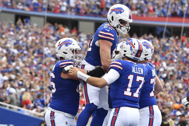 Buffalo Bills quarterback Josh Allen (17) and Dawson Knox celebrate with teammates after they connect for a touchdown during the first half of an NFL football game against the Las Vegas Raiders, Sunday, Sept. 17, 2023, in Orchard Park, N.Y.