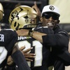 Colorado head coach Deion Sanders, right, hugs his son, safety Shilo Sanders, after he returned an interception for a touchdown in the first half of an NCAA college football game against Colorado State Saturday, Sept. 16, 2023, in Boulder, Colo. 