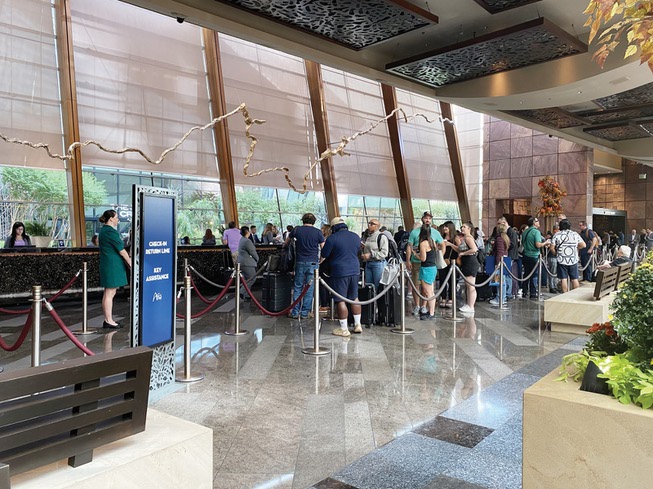 Guests stand in line waiting to check into their rooms Sept. 14 at the Aria. MGM Resorts International was hit with a cyberattack that shut down much of its normal operations, causing longer-than-usual lines and temporarily discontinuing some services.