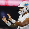 Miami Dolphins quarterback Tua Tagovailoa (1) prepares for a snap during the first half of an NFL football game against the New England Patriots on Sunday, Sept. 17, 2023, in Foxborough, Mass.