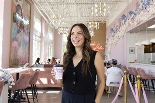 Alexandra Lourdes, co-owner of Cafe Lola, poses for a photo at the coffee shop's Rainbow location Wednesday, Sept. 27, 2023.