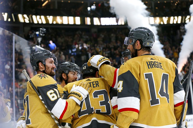 Vegas Golden Knights center Paul Cotter (43) is congratulated by teammates after scoring against the Colorado Avalanche during the third period of an NHL preseason hockey game at T-Mobile Arena Thursday, Oct. 5, 2023.