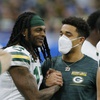 Green Bay Packers wide receiver Davante Adams talks to Jaire Alexander during the second half of an NFL football game against the Detroit Lions, Sunday, Jan. 9, 2022, in Detroit.