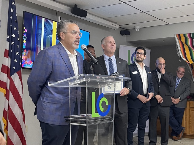 Latin Chamber of Commerce President Peter Guzman, left, and Nevada Gov. Joe Lombardo, second to the left, take turns speaking at an event hosted by the chamber Thursday Oct. 5., 2023.

