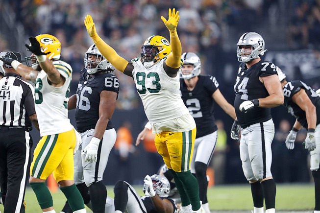 Green Bay Packers defensive tackle T.J. Slaton (93) celebrates as Las Vegas Raiders place kicker Daniel Carlson (2) missed a field goal in the second half of an NFL game against the Green Bay Packers at Allegiant Stadium Monday, Oct. 9, 2023.