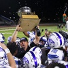 Basic High School football coach Jeff Cahill holds up the “Henderson Bowl” trophy after Basic defeated Green Valley 19-17 at Green Valley High School Friday, Oct. 13, 2023, in Henderson.