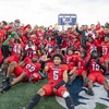 The UNLV football team celebrates its victory against UNR in the Fremont Cannon rivalry game on Oct. 14, 2023, at Mackay Stadium in Reno. 