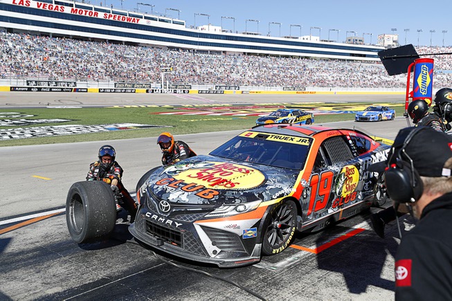 Martin Truex Jr. (19) makes a pit stop during the South Point 400 NASCAR Cup Series auto race at the Las Vegas Motor Speedway Sunday, Oct. 15, 2023.
