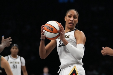 Las Vegas Aces' A'ja Wilson (22) looks to pass during the second half in Game 4 of the WNBA Finals against the New York Liberty, Wednesday, Oct. 18, 2023, in New York. The Aces won 70-69. 


